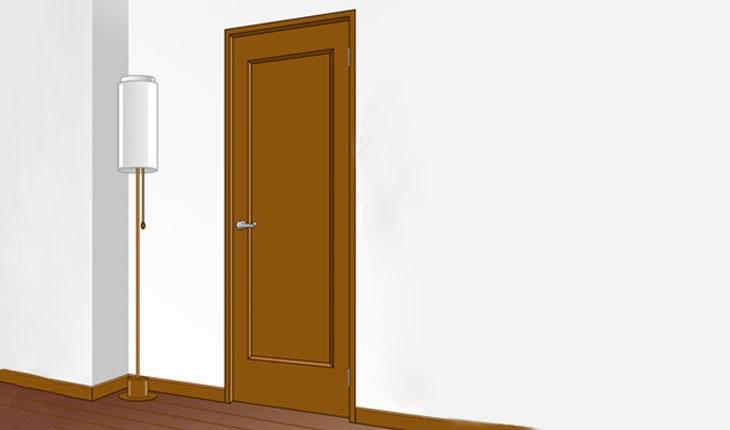 Na imagem, há uma ilustração de uma sala com um abajur perto de uma porta