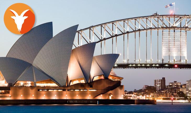 Imagem de estrutura bem desenvolvida e moderna de Sydney com símbolo de Capricórnio ao lado