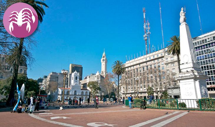 Area com prédios de Buenos Aires e símbolo de Escorpião ao lado