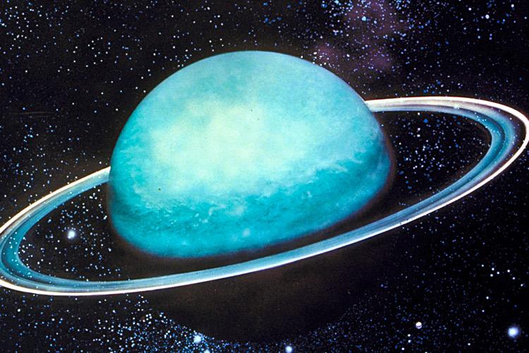 Saturno azul sobre fundo estrelado