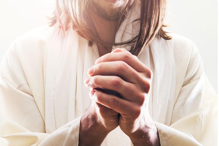 Jesus com as mãos em posição de oração