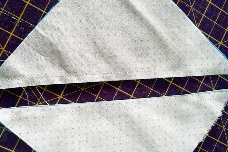 Corte na diagonal de um quadrado de tecido