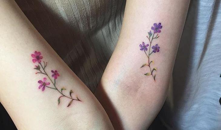 tatuagem mãe e filha no braço