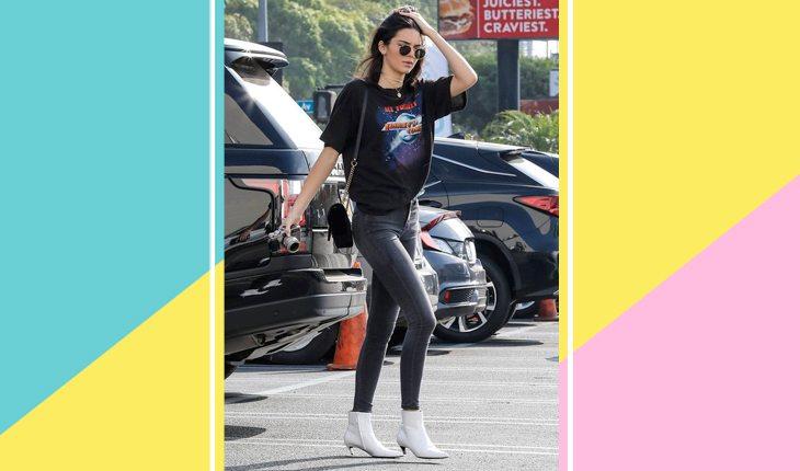 Kendall Jenner com look preto e bota branca