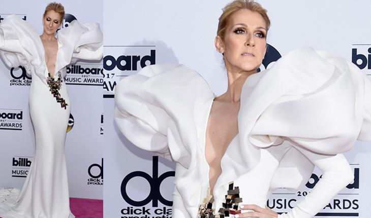 Celine Dion com vestido branco bem colado ao corpo e mangas superbufantes