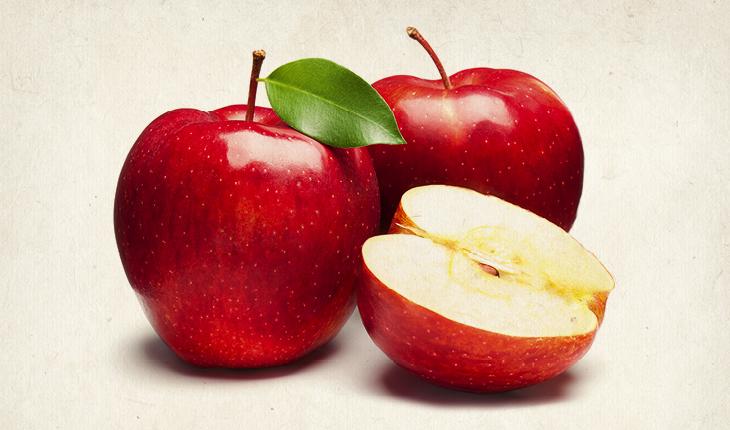 Foto com 3 maçãs que compõe uma lista com os alimentos que dão sensação de bem-estar e tranquilidade.