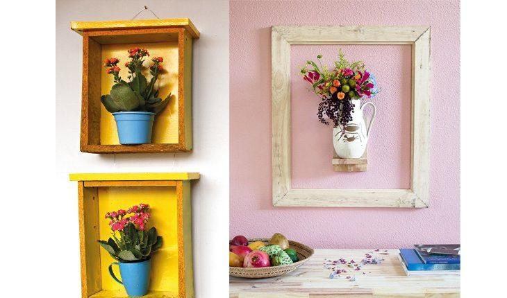 Na foto há dois exemplos de como colocar flores na parede. A primeira foto é com duas gavetas amarelas com vasinhos verdes e flores. A segunda é de um vaso pendurado com uma moldura em volta.